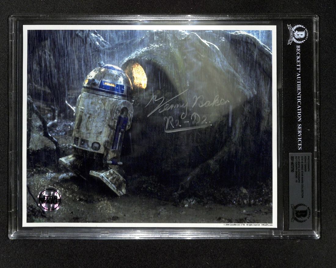 Kenny Baker Signed Star Wars R2-D2 8x10 Photo Beckett Authenticated: Kenny Baker Signed Star Wars R2-D2 8x10 Photo Beckett Authenticated This authentic 8x10 photograph features Kenny Baker's signature, who famously portrayed R2-D2 in Star Wars. Signed in permanent mark