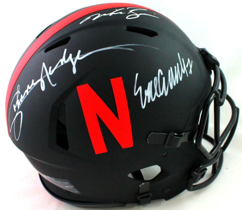 Nebraska Cornhuskers Eclipse Speed Authentic Helmet signed by 3 Heisman winners JSA: Nebraska Cornhuskers Eclipse Speed Authentic Helmet signed by 3 Heisman winners JSA This authentic football helmet features autographs from Eric Crouch, Mike Rozier, and Johnny Rodgers, representing t