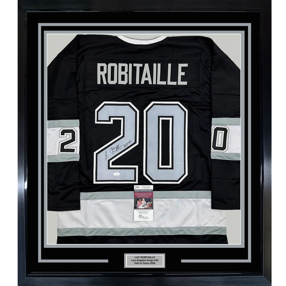 Framed Luc Robitaille HOF 09 Autographed Jersey 35x39 JSA COA: Framed Luc Robitaille HOF 09 Autographed Jersey 35x39 JSA COA This professionally framed and matted display features a black jersey autographed by Luc Robitaille, a celebrated NHL player and Hall of F