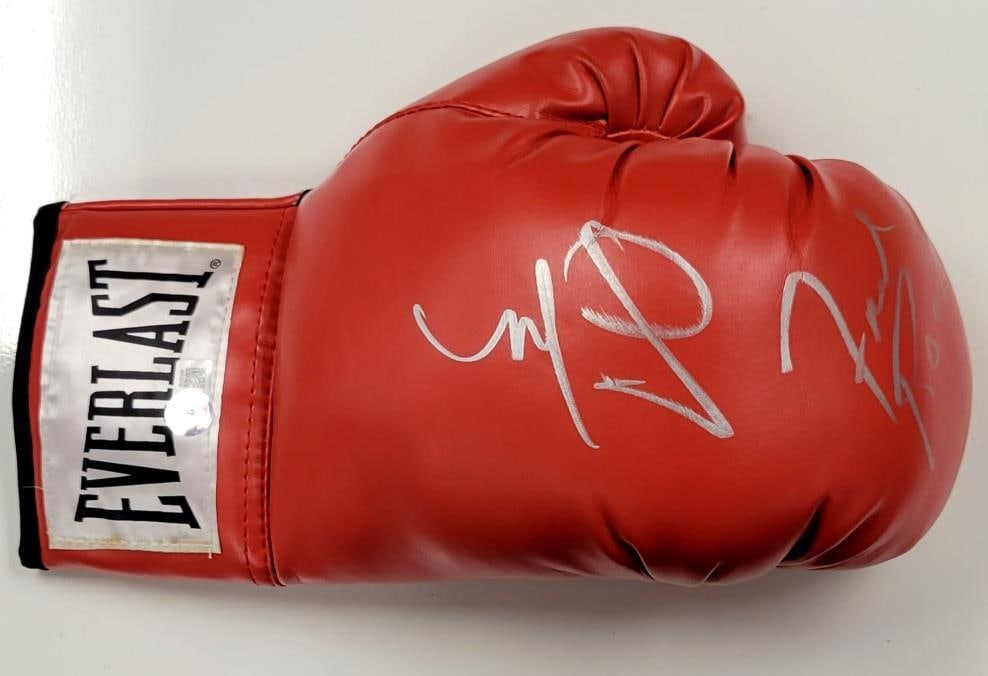 Miguel Cotto Freddie Roach Signed Boxing Glove Beckett Authenticated: Miguel Cotto Freddie Roach Signed Boxing Glove Beckett Authenticated This authentic boxing glove is signed by the legendary Miguel Cotto and renowned trainer Freddie Roach. The glove is certified by B