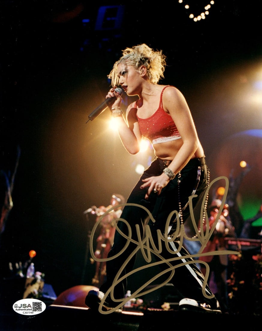8x10 Photograph Signed by Gwen Stefani JSA Authenticated: 8x10 Photograph Signed by Gwen Stefani JSA Authenticated This is an original 8x10 photograph featuring Gwen Stefani, lead singer of No Doubt, captured on stage. The photo is hand-signed by Gwen Stefan