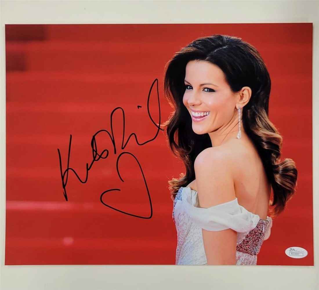 11x14 Kate Beckinsale autographed photo with heart drawing JSA authenticated: 11x14 Kate Beckinsale autographed photo with heart drawing JSA authenticated This original 11x14 photograph is signed by Kate Beckinsale and features a drawn heart. The autograph is authenticated by J
