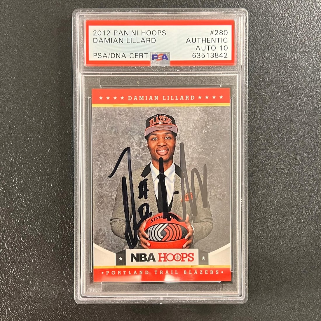PSA Slabbed Damian Lillard 2012 NBA Hoops Rookie Auto Card #280: PSA Slabbed Damian Lillard 2012 NBA Hoops Rookie Auto Card #280 This 2012 NBA Hoops #280 rookie card features Damian Lillard and has been personally signed by him. The autograph is authenticated by PS