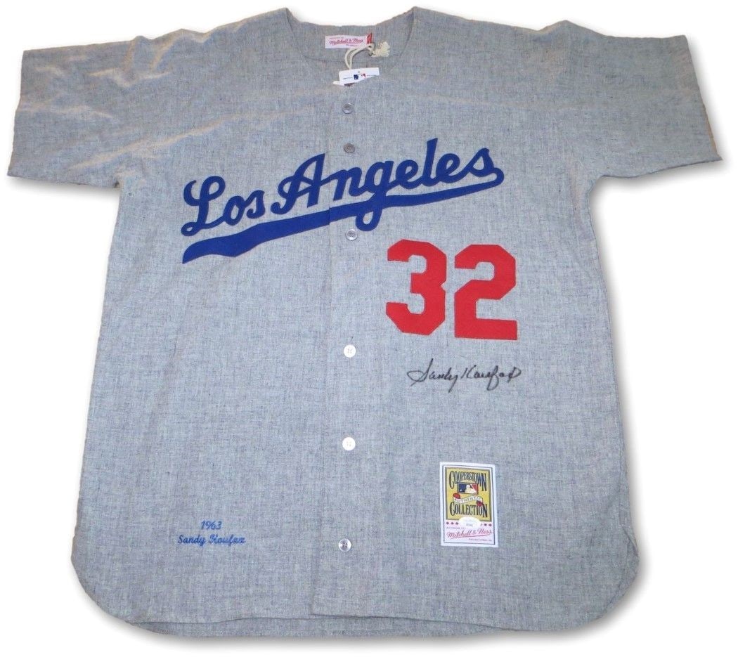 Sandy Koufax Autographed 1963 Dodgers Jersey Size 40 JSA Certified: Sandy Koufax Autographed 1963 Dodgers Jersey Size 40 JSA Certified Celebrate baseball history with this authentic 1963 Los Angeles Dodgers jersey, featuring the legendary Sandy Koufax's autograph. Thi