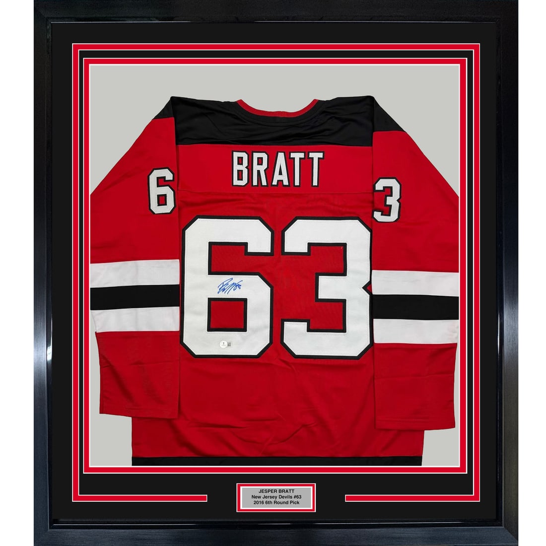 Framed Jesper Bratt Signed Red Jersey New Jersey Devils Beckett COA: Framed Jesper Bratt Signed Red Jersey New Jersey Devils Beckett COA This stunning framed autographed Jesper Bratt red hockey jersey is a must-have for any New Jersey Devils fan. Measuring 35x39 inches