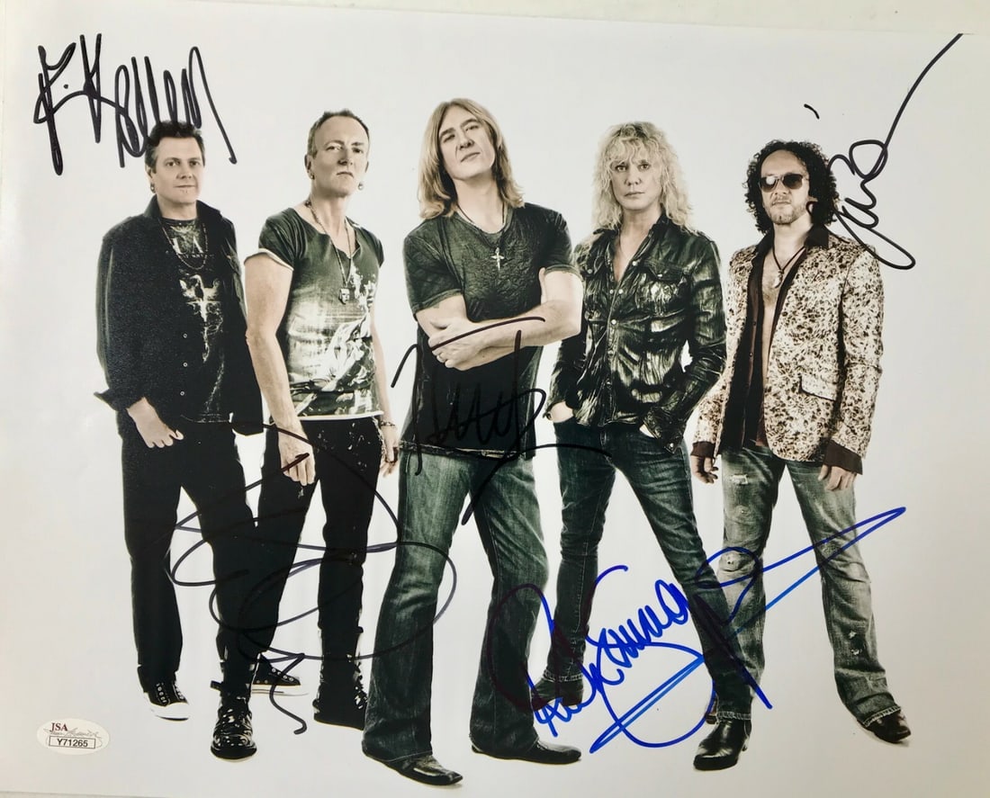 Def Leppard Signed 11x14 Photo by All 5 Members JSA Authenticated: Def Leppard Signed 11x14 Photo by All 5 Members JSA Authenticated This rare 11x14 photograph features the full lineup of the iconic rock band Def Leppard, with autographs from all five members: Joe El
