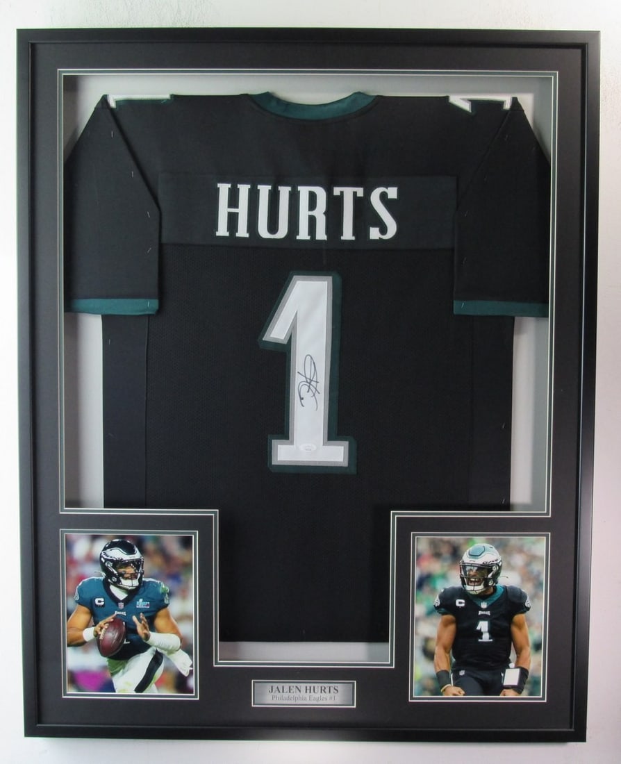 Jalen Hurts Signed Black Eagles Jersey Framed with JSA Authentication: Jalen Hurts Signed Black Eagles Jersey Framed with JSA Authentication This offering features a Jalen Hurts signed black custom football jersey from the Philadelphia Eagles, elegantly framed to showcas