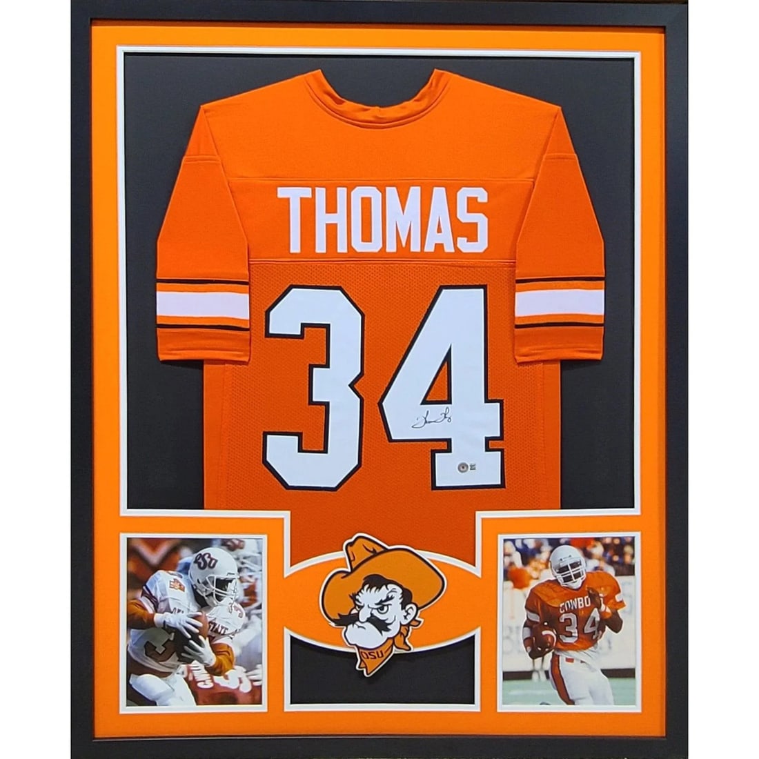 Thurman Thomas Signed Framed Oklahoma State Jersey Beckett Authenticated: Thurman Thomas Signed Framed Oklahoma State Jersey Beckett Authenticated This is a framed autographed jersey of Thurman Thomas, a celebrated player from Oklahoma State. The jersey comes with a Beckett