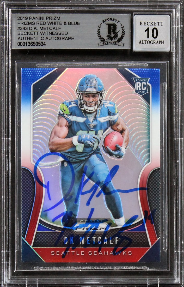D.K. Metcalf Autographed 2019 Panini Prizm Red White Blue Rookie Card Beckett 10: D.K. Metcalf Autographed 2019 Panini Prizm Red White Blue Rookie Card Beckett 10 This is a 2019 Panini Prizm Prizms Red White & Blue #343 Rookie Card featuring D.K. Metcalf of the Seattle Seahawks. Th