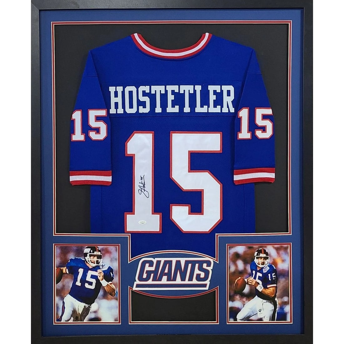 Beckett Authenticated Jeff Hostetler Autographed Framed New York Giants Jersey: Beckett Authenticated Jeff Hostetler Autographed Framed New York Giants Jersey Framed autographed Jeff Hostetler jersey featuring New York Giants branding. The piece is presented in a detailed frame w