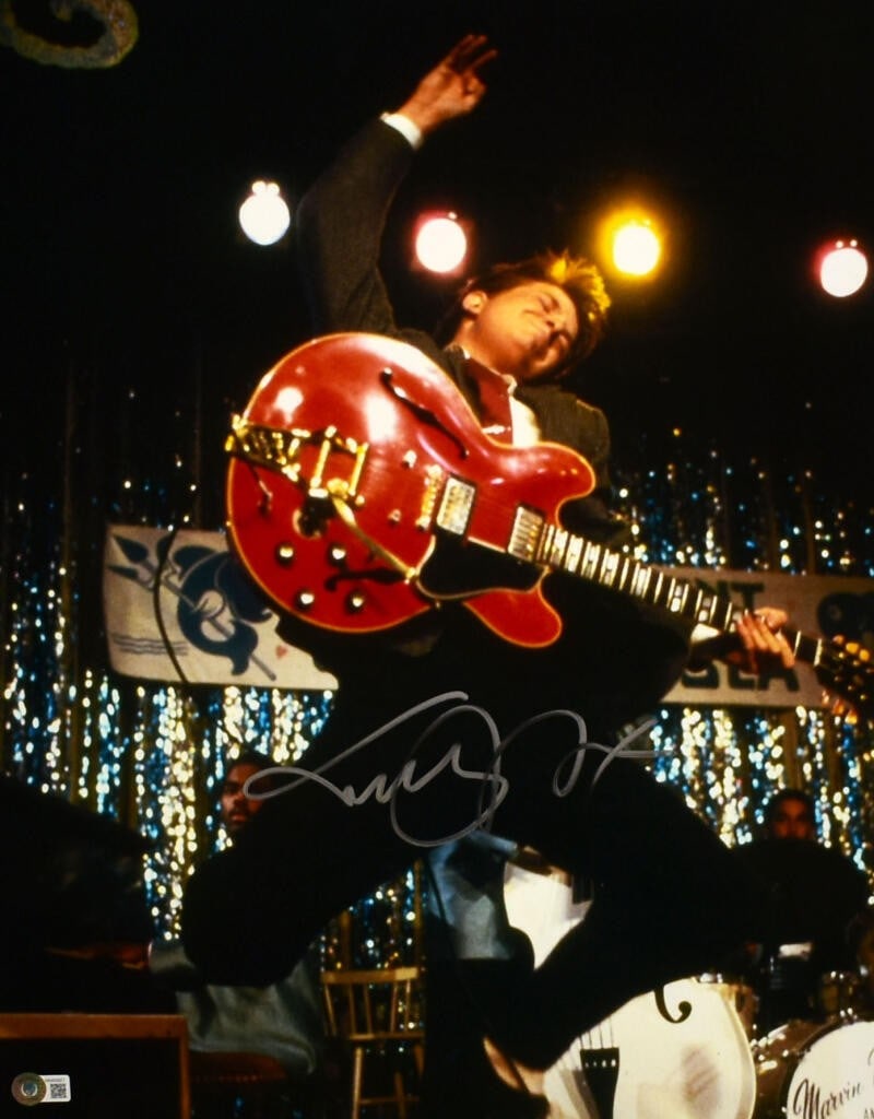 Beckett Holo Michael J Fox Back to the Future Signed 16x20 Photo: Beckett Holo Michael J Fox Back to the Future Signed 16x20 Photo This 16x20 photograph features Michael J. Fox and is autographed by him. The photo depicts a scene from the movie 'Back to the Future' 
