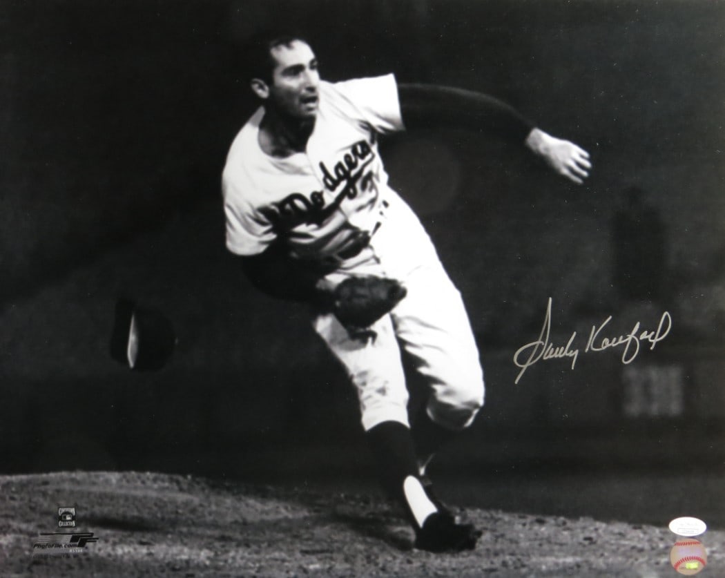 Sandy Koufax Autographed 16x20 Photo JSA Authenticated Dodgers: Sandy Koufax Autographed 16x20 Photo JSA Authenticated Dodgers Own a piece of baseball history with this authentic 16X20 photograph of Sandy Koufax, capturing his last out during the perfect game. Thi