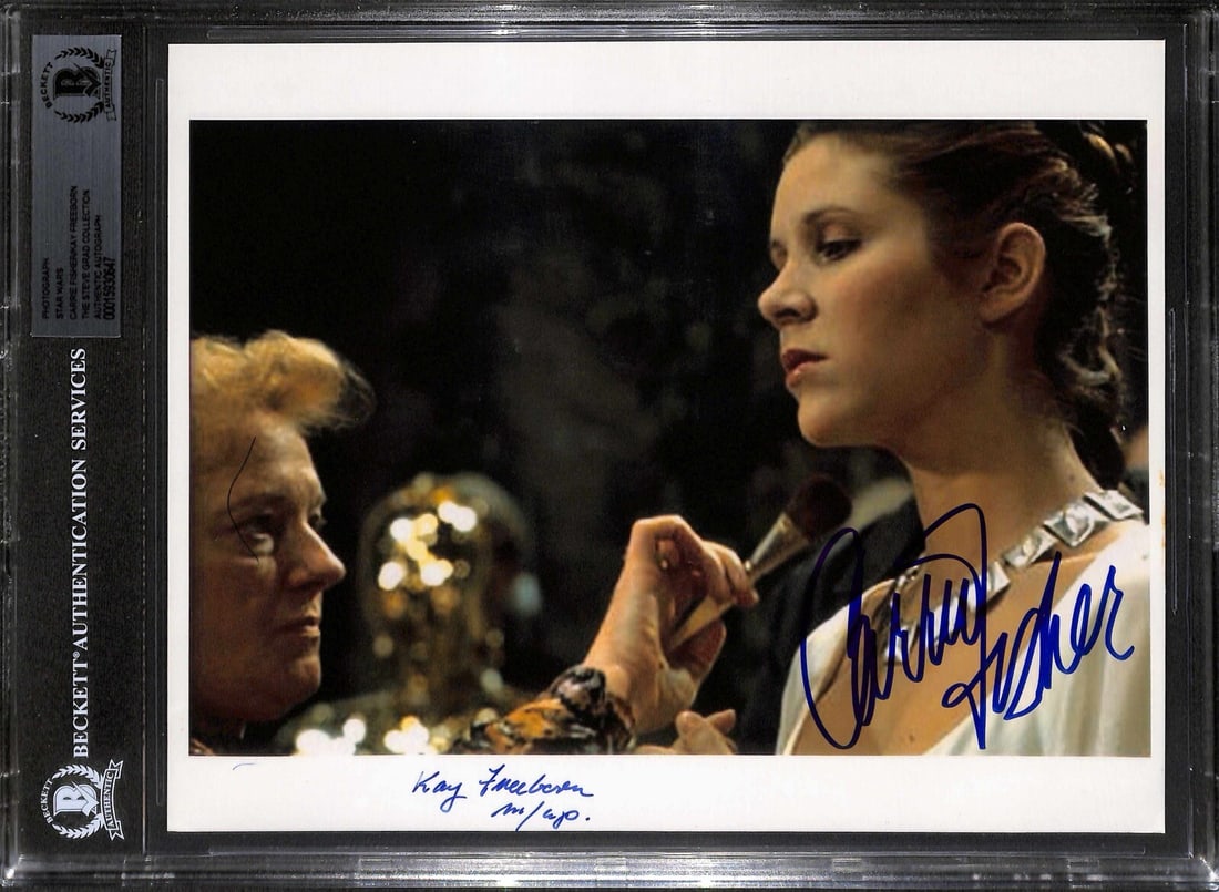 Beckett slabbed 8x10 Star Wars autograph photo Carrie Fisher Kay Freeborn: Beckett slabbed 8x10 Star Wars autograph photo Carrie Fisher Kay Freeborn This is an original 8x10 photograph from Star Wars: A New Hope, autographed in blue permanent marker by Carrie Fisher and Kay 
