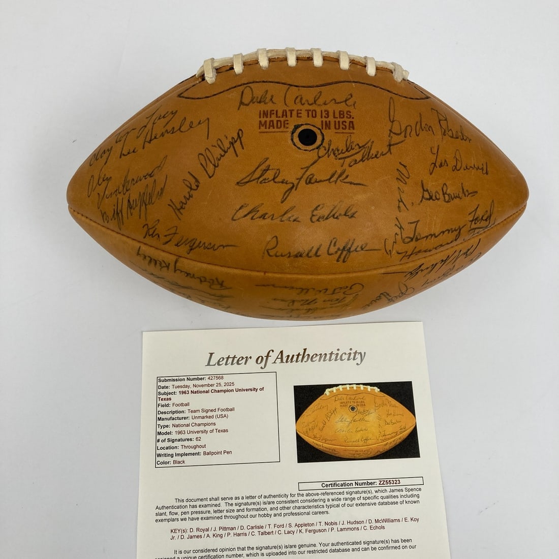 1963 Texas Longhorns Team Signed Football with JSA COA: 1963 Texas Longhorns Team Signed Football with JSA COA Celebrate the legacy of the 1963 University of Texas Longhorns with this NCAA Champions Team Signed Football. This remarkable tan leather footbal