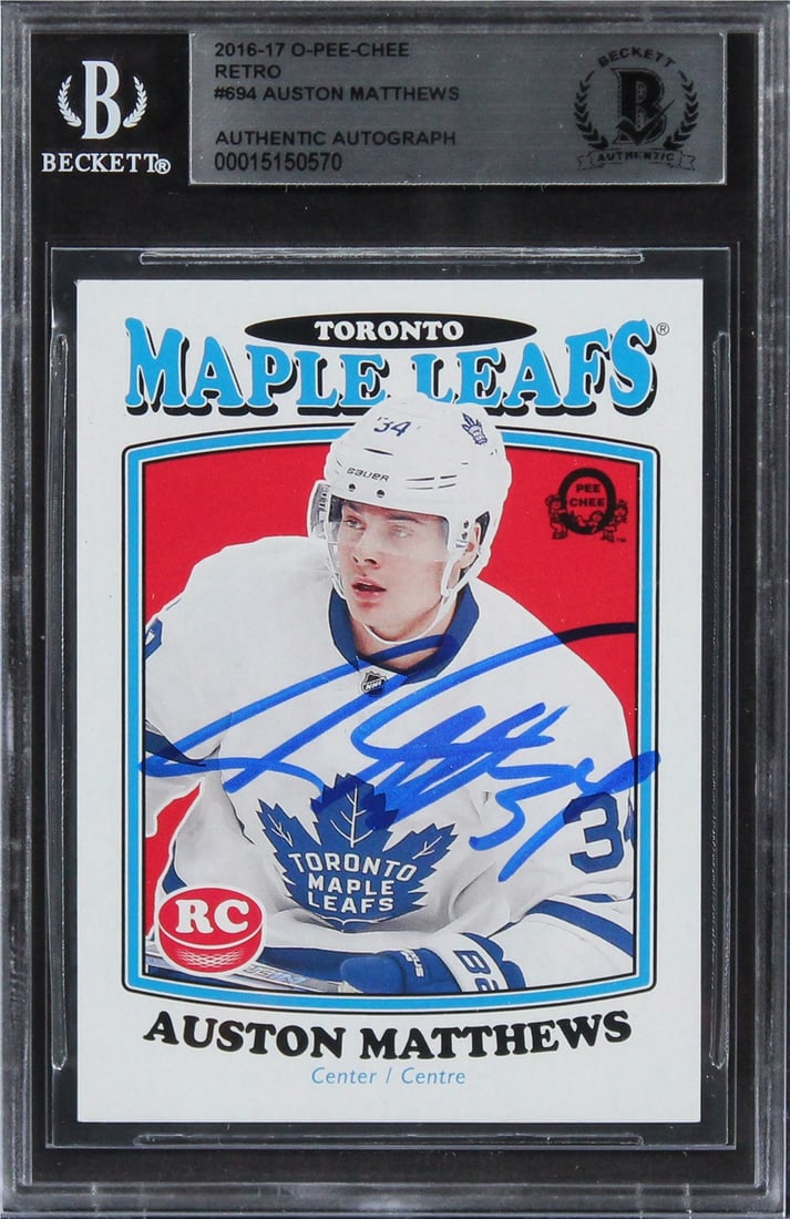 Auston Matthews Signed 2016 O-Pee-Chee Retro RC #694 Beckett Authenticated: Auston Matthews Signed 2016 O-Pee-Chee Retro RC #694 Beckett Authenticated This is a 2016 O-Pee-Chee Retro #694 Rookie Card personally signed by Auston Matthews, one of the standout players of the Tor