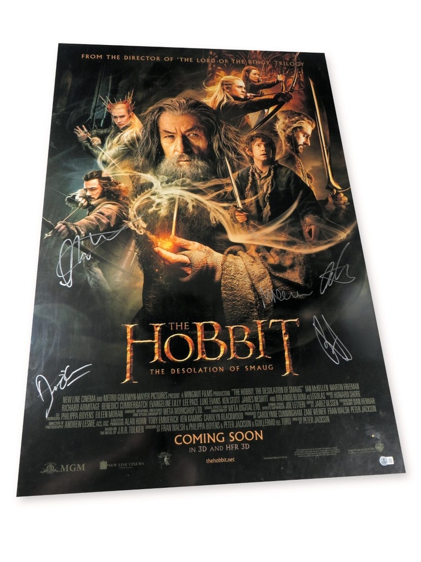 27X40 The Hobbit Desolation of Smaug Poster 7 Signatures BAS: 27X40 The Hobbit Desolation of Smaug Poster 7 Signatures BAS Original autographed poster for The Hobbit: The Desolation of Smaug. It is signed by Evangeline Lilly, Martin Freeman, Benedict Cumberbatch