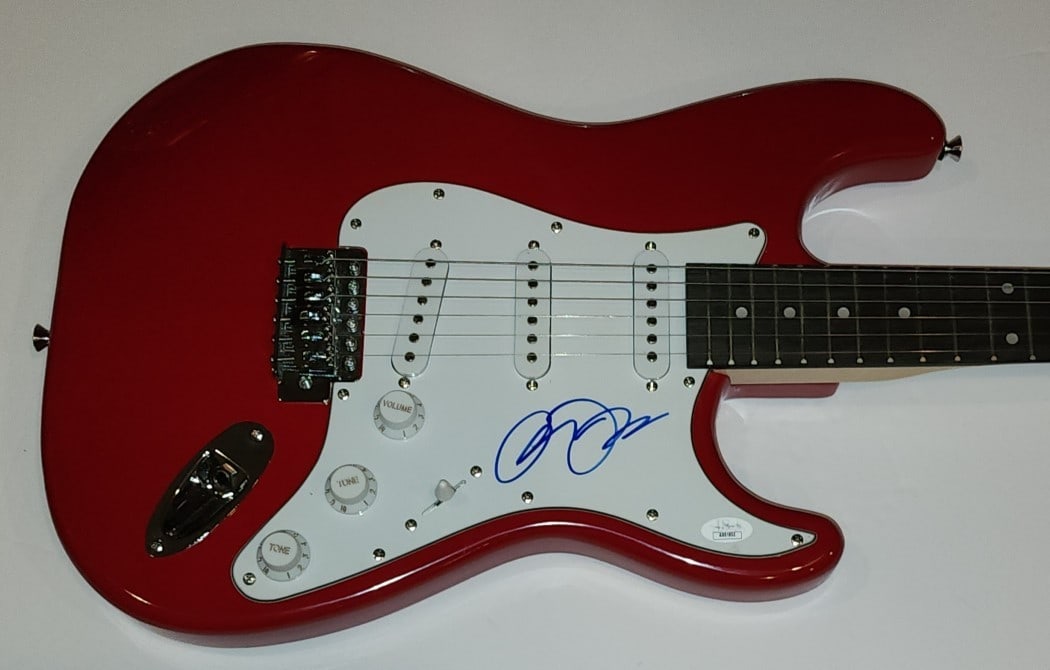 Electric Guitar Signed by Alisan Porter JSA Authenticated with COA: Electric Guitar Signed by Alisan Porter JSA Authenticated with COA This electric guitar and guitar pick have been autographed by Alisan Porter, the singer and actress known for her role in Curly Sue. 
