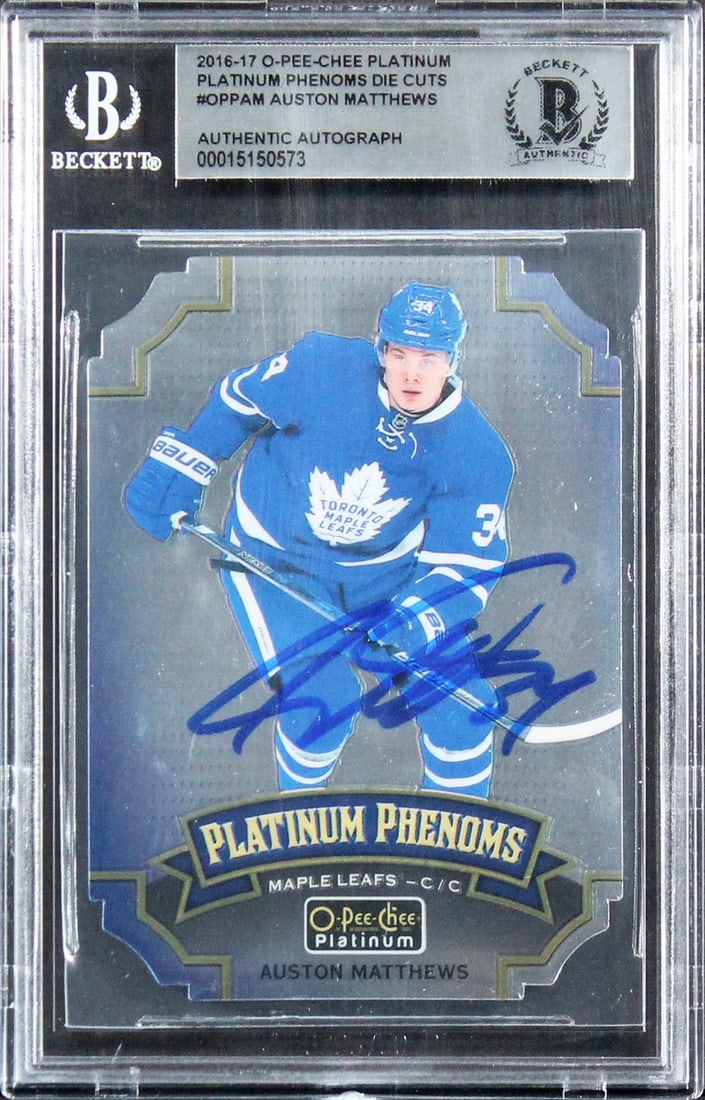 Auston Matthews Signed 2016 O-Pee-Chee Platinum Rookie Card Beckett Authenticated: Auston Matthews Signed 2016 O-Pee-Chee Platinum Rookie Card Beckett Authenticated This is a 2016 O-Pee-Chee Platinum Phenoms Die Cuts #OPPAM Rookie Card, personally signed by Auston Matthews of the To