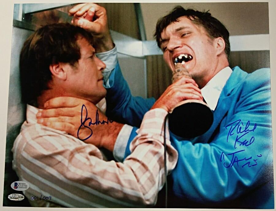 James Bond 11x14 Photograph Signed by Roger Moore and Richard Kiel Beckett COA: James Bond 11x14 Photograph Signed by Roger Moore and Richard Kiel Beckett COA This original 11x14 photograph from James Bond is signed by both Roger Moore and Richard Kiel. It is an authentic collect