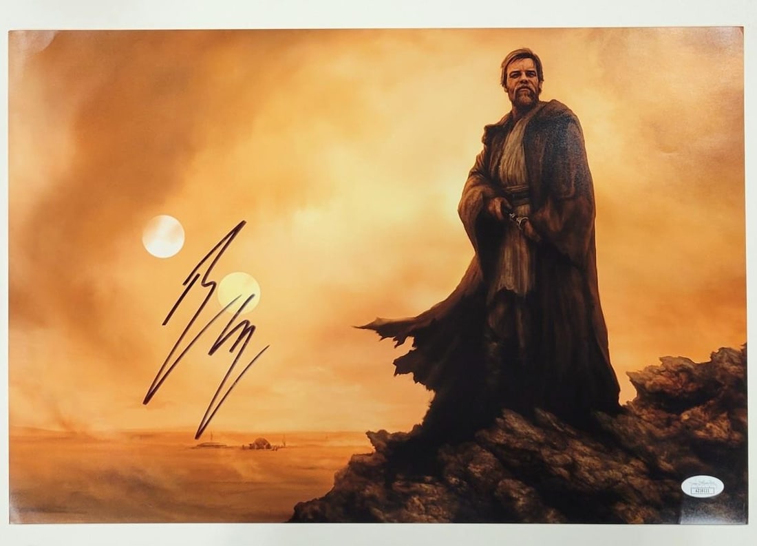 Ewan McGregor Obi-Wan Kenobi 12x18 Signed Photo Star Wars JSA COA: Ewan McGregor Obi-Wan Kenobi 12x18 Signed Photo Star Wars JSA COA This striking 12x18 photograph features Ewan McGregor as Obi-Wan Kenobi from the iconic Star Wars franchise. The image is an original 