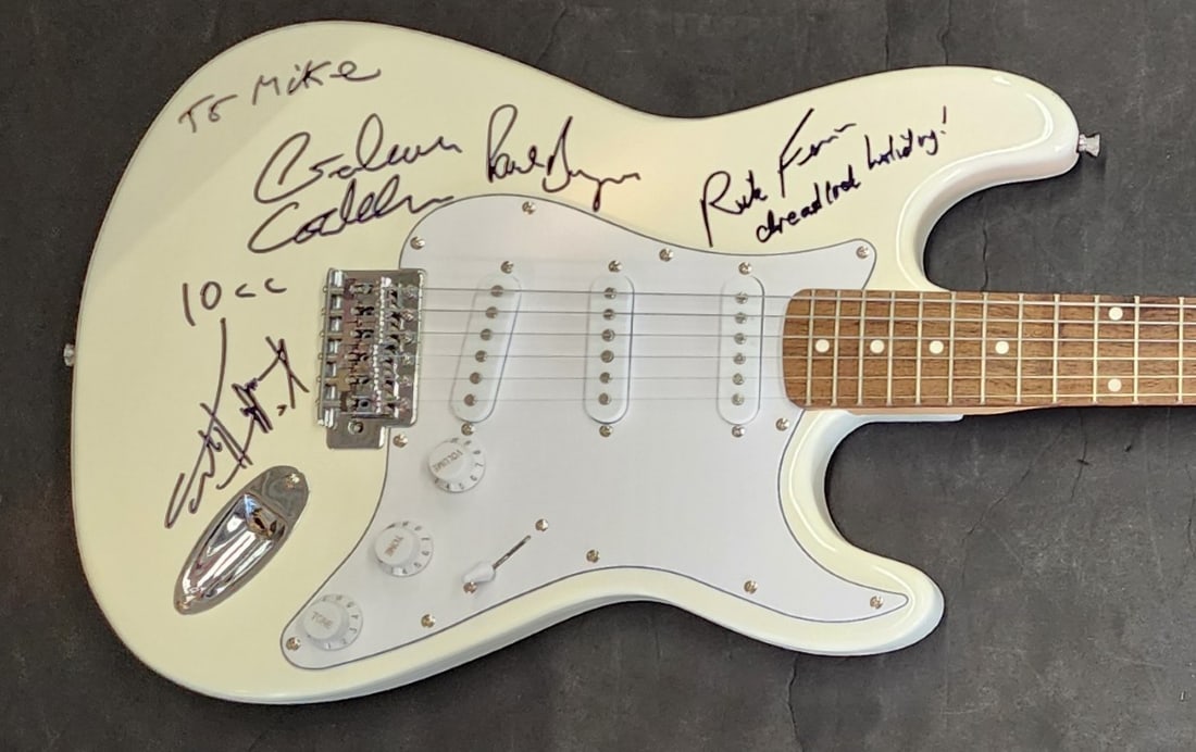 10CC Autographed Electric Guitar Beckett Authenticated Rock Band: 10CC Autographed Electric Guitar Beckett Authenticated Rock Band This original electric guitar is autographed by members of the legendary rock band 10CC, including Graham Gouldman, Rick Feen, Paul Bur