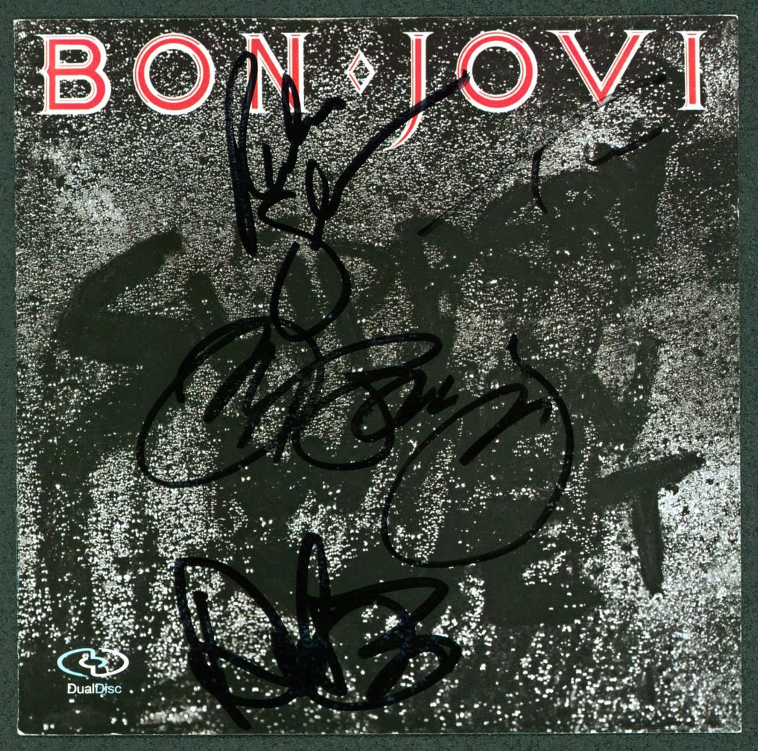 Bon Jovi Signed Slippery When Wet CD Cover with Beckett COA: Bon Jovi Signed Slippery When Wet CD Cover with Beckett COA This is an original CD cover for Bon Jovi's "Slippery When Wet", personally signed by all four band members: John Bon Jovi, Richie Sambora, 