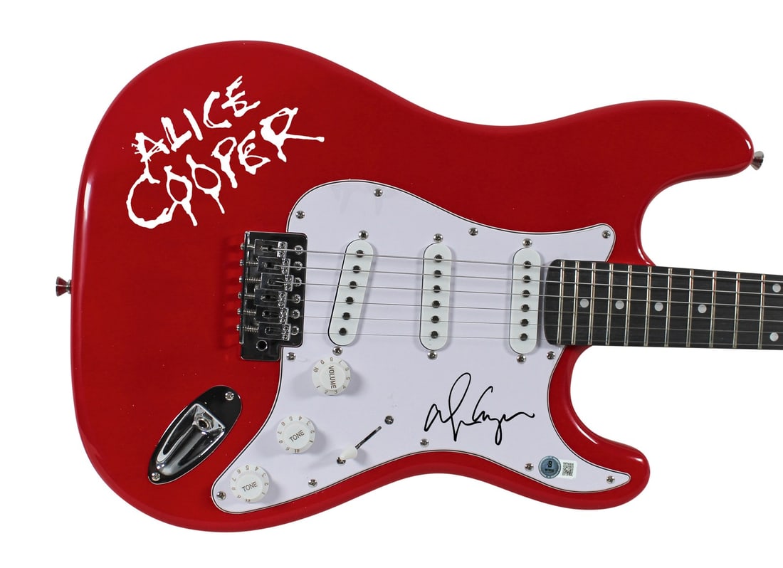 Red Electric Guitar Signed by Alice Cooper with Beckett COA and Decal: Red Electric Guitar Signed by Alice Cooper with Beckett COA and Decal This red electric guitar, complete with a decal, has been personally signed by Alice Cooper. The autograph is authenticated by Bec