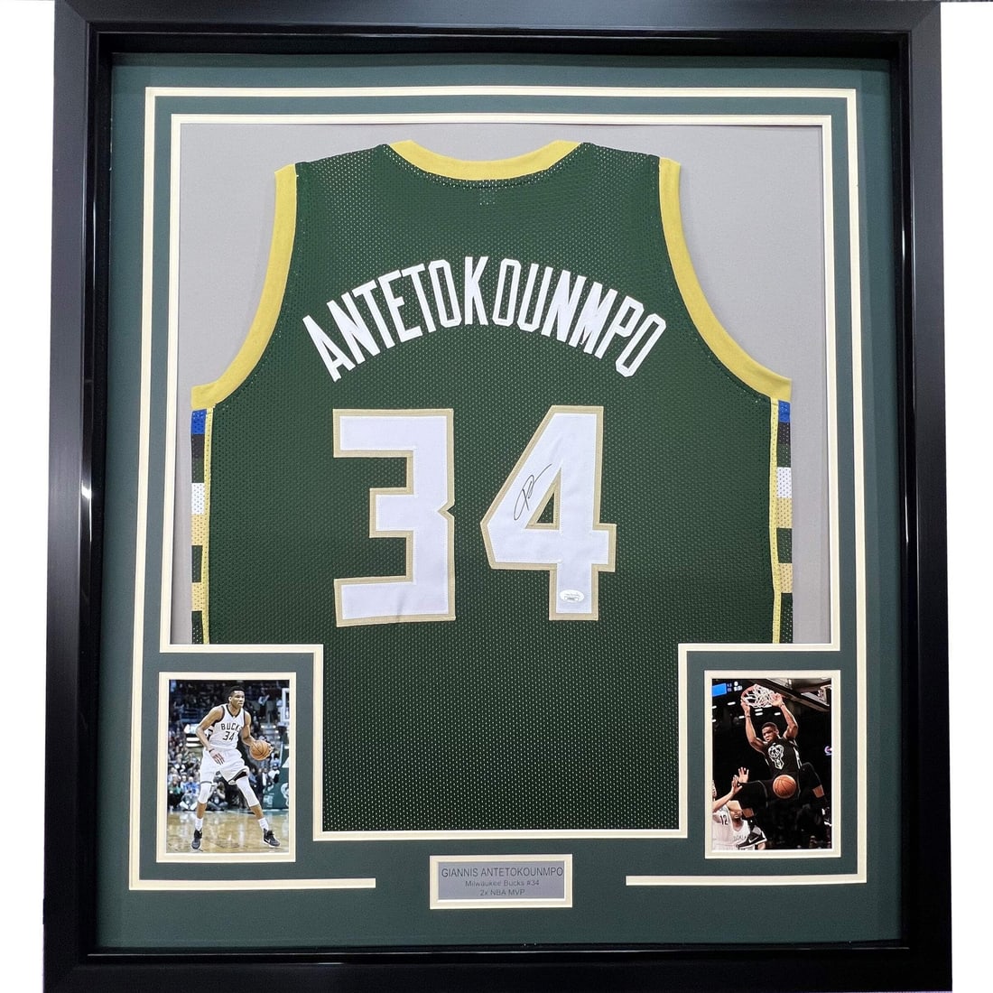 Framed Signed Giannis Antetokounmpo Jersey 33x42 JSA Authentication: Framed Signed Giannis Antetokounmpo Jersey 33x42 JSA Authentication Celebrate the legacy of Giannis Antetokounmpo with this stunning framed and autographed green jersey. This authentic NBA jersey feat