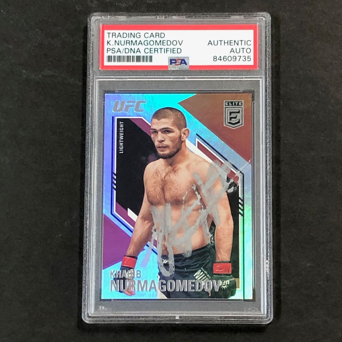 2021 Panini Chronicles Elite Khabib Nurmagomedov Signed Card PSA Authenticated: 2021 Panini Chronicles Elite Khabib Nurmagomedov Signed Card PSA Authenticated This is a 2021 Panini Chronicles Elite #146 trading card featuring a signed autograph of mixed martial arts champion Khab