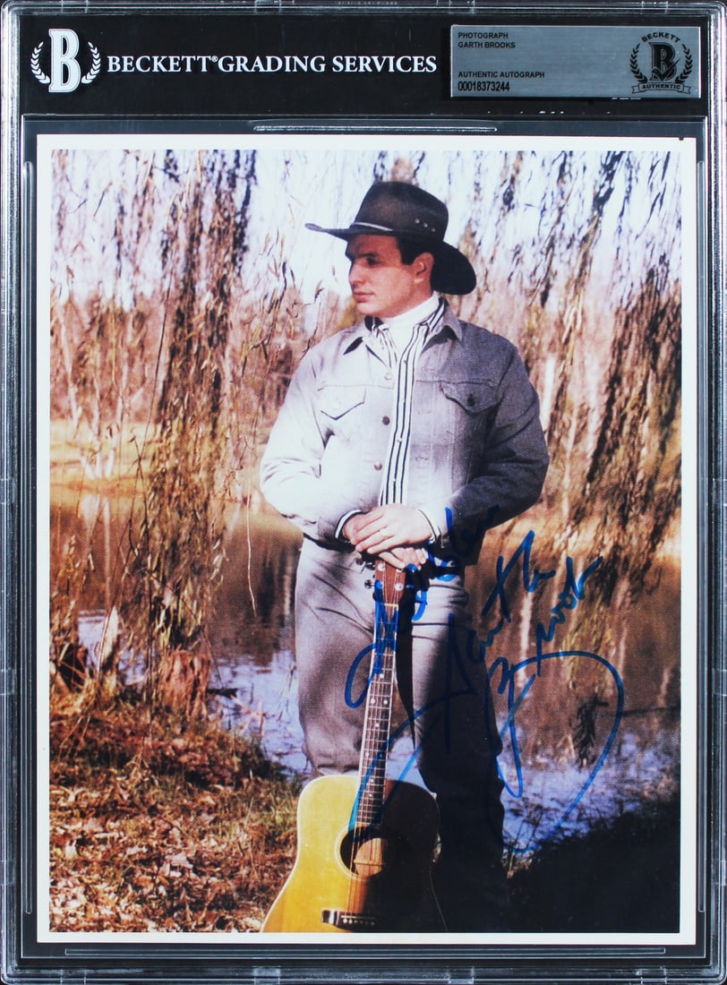 Slabbed 8x10 Photograph Signed by Garth Brooks Beckett Authenticated: Slabbed 8x10 Photograph Signed by Garth Brooks Beckett Authenticated This 8x10 photograph has been personally signed by Garth Brooks. The autograph has been authenticated and slabbed by Beckett Authen