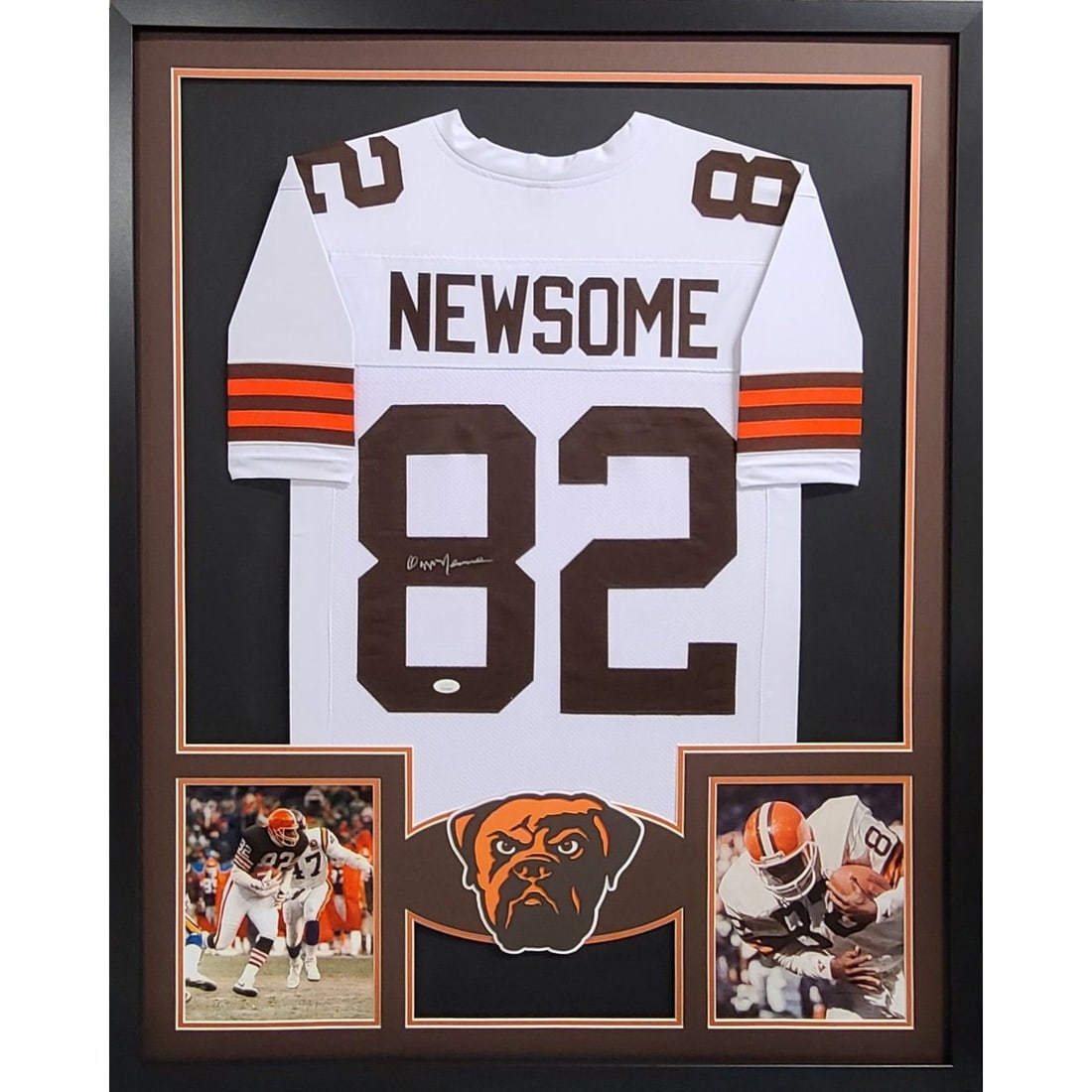 Framed Cleveland Browns Jersey Signed by Ozzie Newsome JSA Authenticated: Framed Cleveland Browns Jersey Signed by Ozzie Newsome JSA Authenticated This is a framed Cleveland Browns jersey autographed by Ozzie Newsome. The jersey has been authenticated by JSA and includes a 