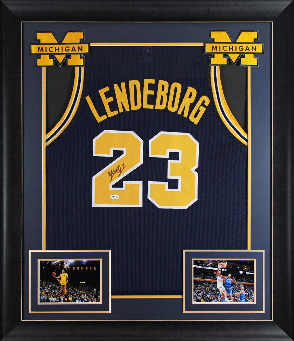 Framed Navy Pro Style Jersey Signed by Yaxel Lendeborg JSA Michigan: Framed Navy Pro Style Jersey Signed by Yaxel Lendeborg JSA Michigan Authentic signed navy pro style framed jersey personally autographed by Yaxel Lendeborg of the Michigan Wolverines. This original au