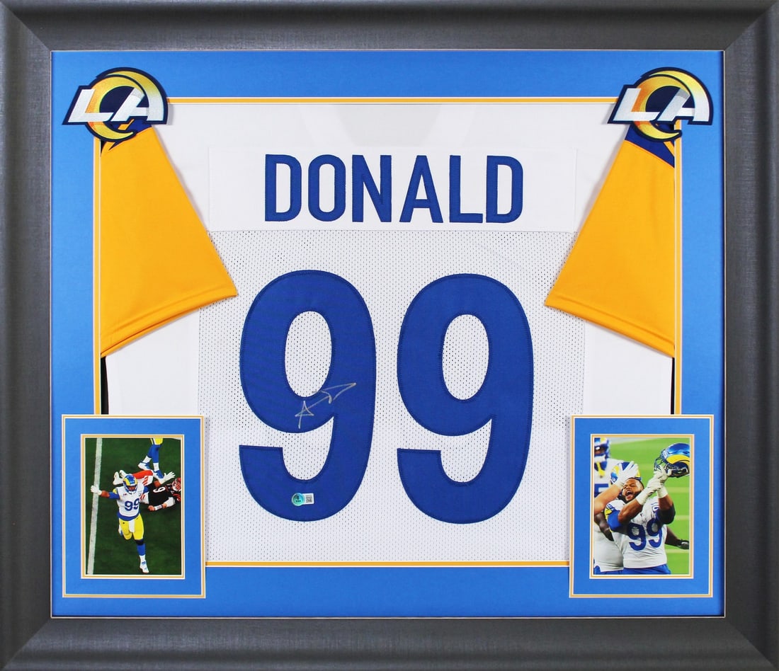 Aaron Donald Signed White Framed Jersey BAS Witnessed Los Angeles Rams: Aaron Donald Signed White Framed Jersey BAS Witnessed Los Angeles Rams This authentic white pro style framed jersey has been personally signed by NFL superstar Aaron Donald of the Los Angeles Rams. It
