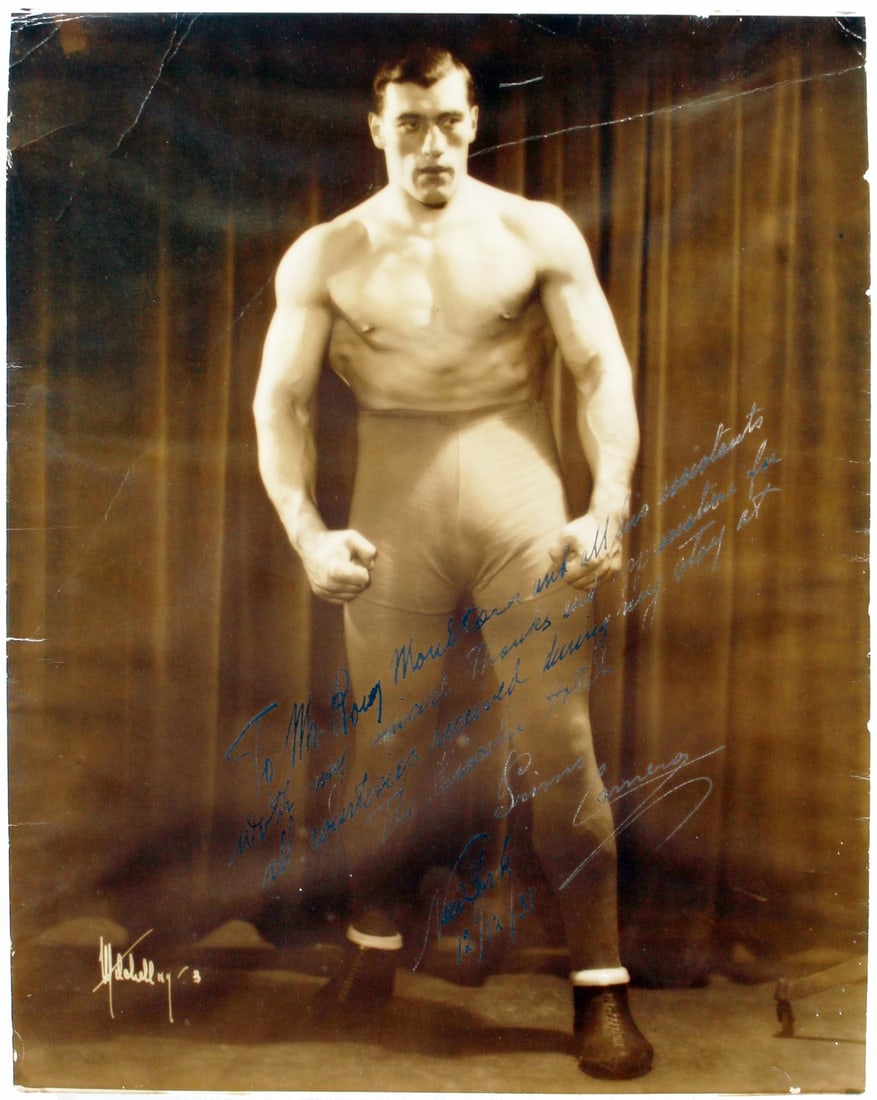 Primo Carnera Signed 1931 Vintage Sepia Photo JSA COA 13x16.5: Primo Carnera Signed 1931 Vintage Sepia Photo JSA COA 13x16.5 This is an authentic signed vintage sepia photo of boxing legend Primo Carnera, measuring 13x16.5 inches. The photograph features an inscr
