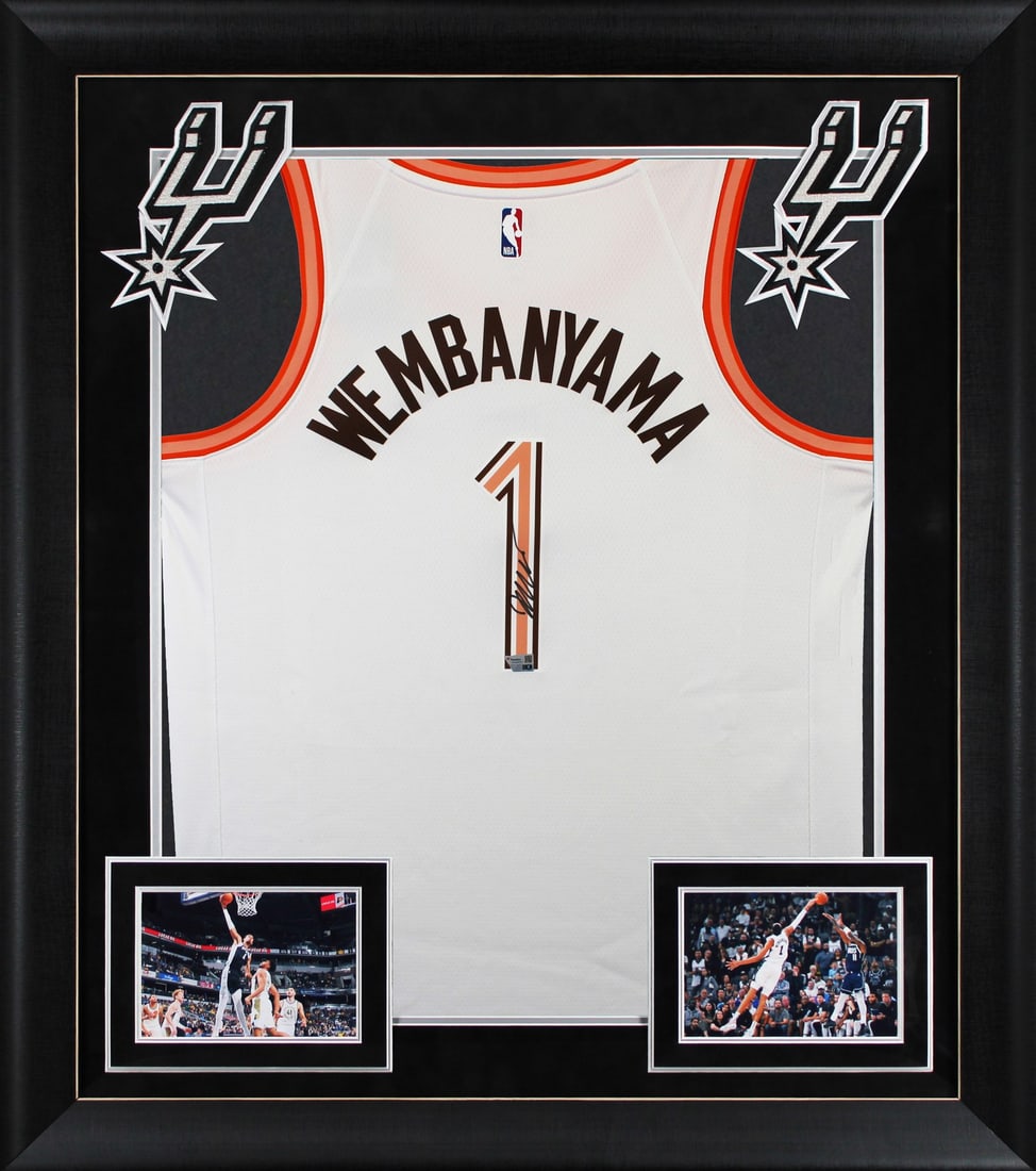 Framed Victor Wembanyama Signed Spurs Nike City Edition Jersey Fanatics: Framed Victor Wembanyama Signed Spurs Nike City Edition Jersey Fanatics Framed white Nike City Edition jersey signed by Victor Wembanyama of the San Antonio Spurs. This original autographed piece incl