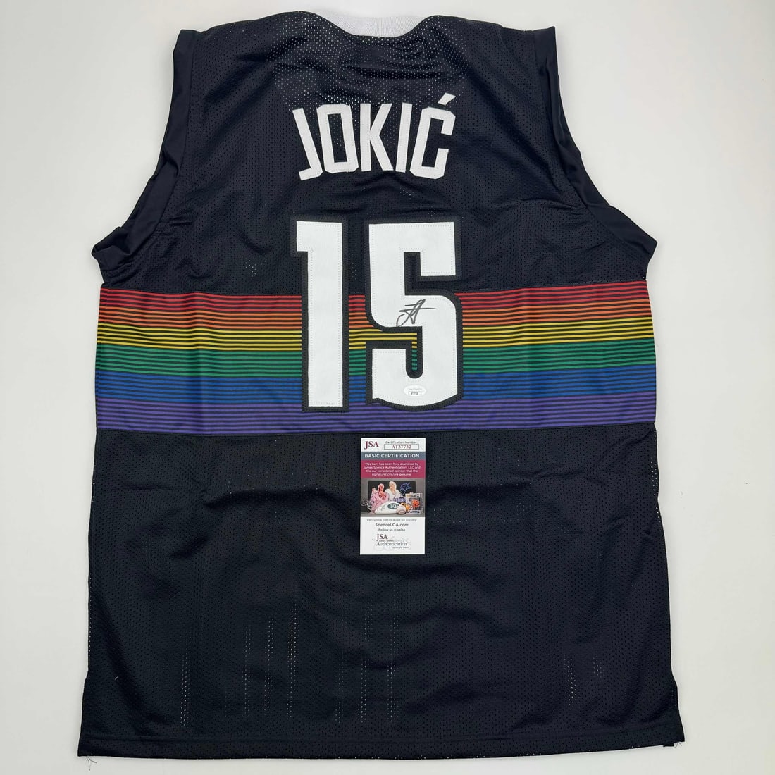 Autographed Nikola Jokic Black Rainbow Jersey JSA COA Denver Nuggets: Autographed Nikola Jokic Black Rainbow Jersey JSA COA Denver Nuggets This is an autographed Nikola Jokic Denver Black Rainbow Basketball Jersey, featuring the iconic player's name and number. The jers