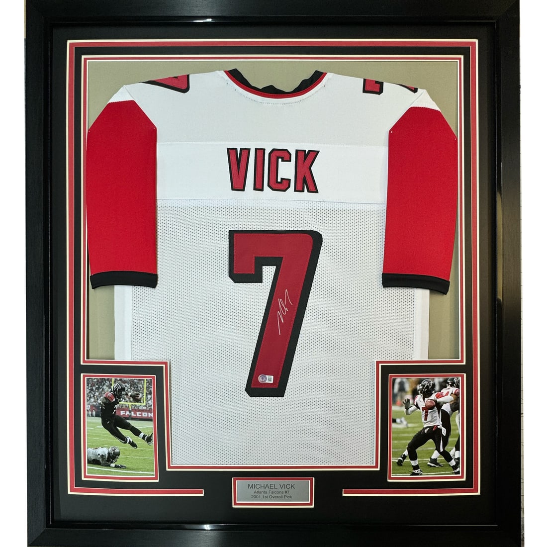 Framed Signed Michael Vick Atlanta Falcons Jersey with PSA COA: Framed Signed Michael Vick Atlanta Falcons Jersey with PSA COA This professionally framed and matted jersey features the autograph of NFL star Michael Vick. The item showcases an authentic Atlanta Fal