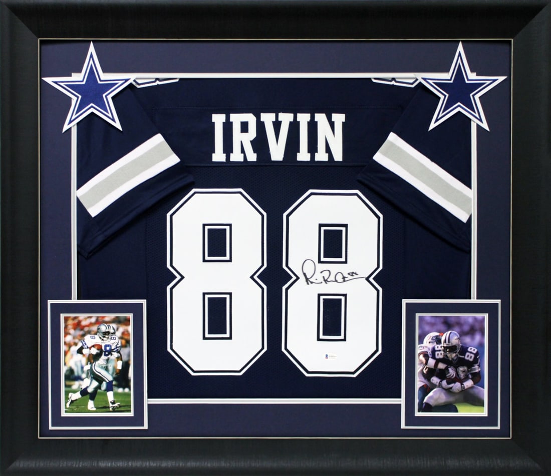 Framed Navy Dallas Jersey Signed by Michael Irvin Beckett Witness Authentication: Framed Navy Dallas Jersey Signed by Michael Irvin Beckett Witness Authentication This navy blue pro style jersey is personally signed by Michael Irvin of the Dallas Cowboys. The jersey is custom-stitc