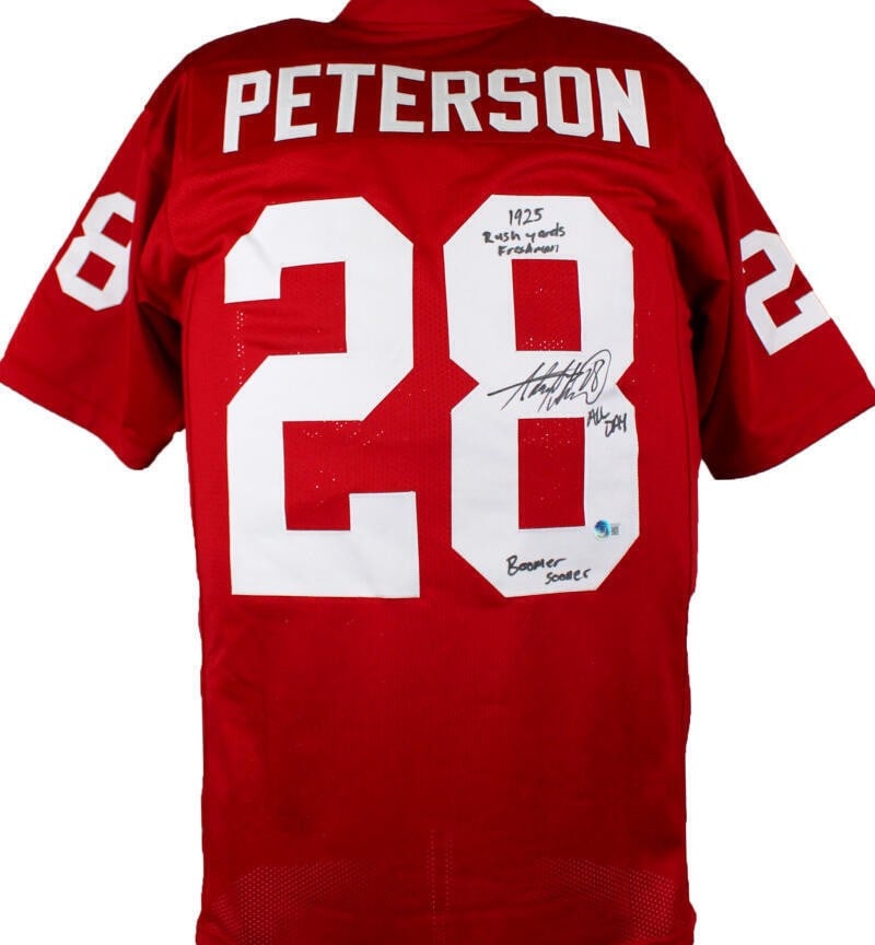 Adrian Peterson Autographed College Jersey with 3 Inscriptions BAS: Adrian Peterson Autographed College Jersey with 3 Inscriptions BAS Maroon college-style jersey signed by Adrian Peterson, featuring three inscriptions and a BAW hologram. The item is pre-owned and was