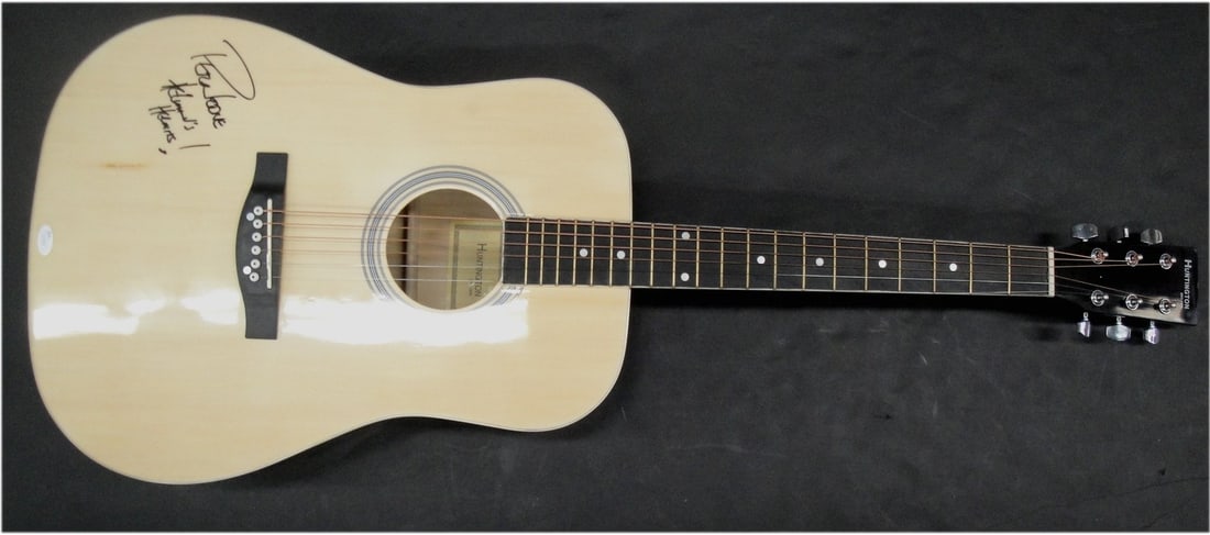 Acoustic Guitar Autographed by Peter Noone JSA Authenticated: Acoustic Guitar Autographed by Peter Noone JSA Authenticated This is a pre-owned acoustic guitar hand signed by Peter Noone. The autograph is located on the body of the guitar and is authenticated by 