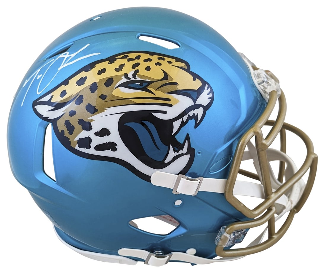 Trevor Lawrence Signed Jacksonville Jaguars Flash Helmet with Fanatics Hologram: Trevor Lawrence Signed Jacksonville Jaguars Flash Helmet with Fanatics Hologram This authentic full-size Speed Proline helmet features the alternate Flash design and has been personally signed by Trev