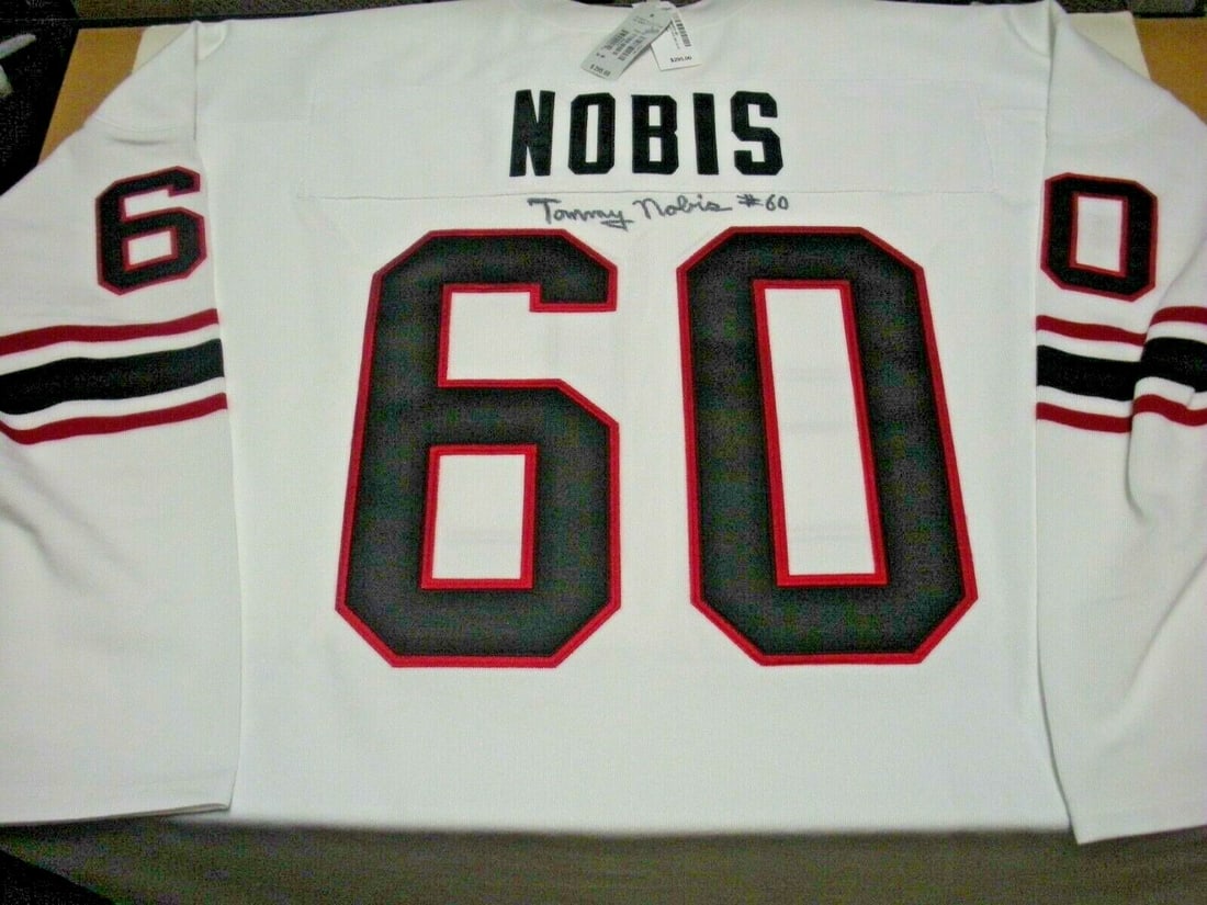 Signed Atlanta Falcons Jersey by Tommy Nobis with COA Mitchell and Ness Licensed: Signed Atlanta Falcons Jersey by Tommy Nobis with COA Mitchell and Ness Licensed This is an official licensed Mitchell & Ness Atlanta Falcons jersey signed by Tommy Nobis. The jersey comes with a Cert
