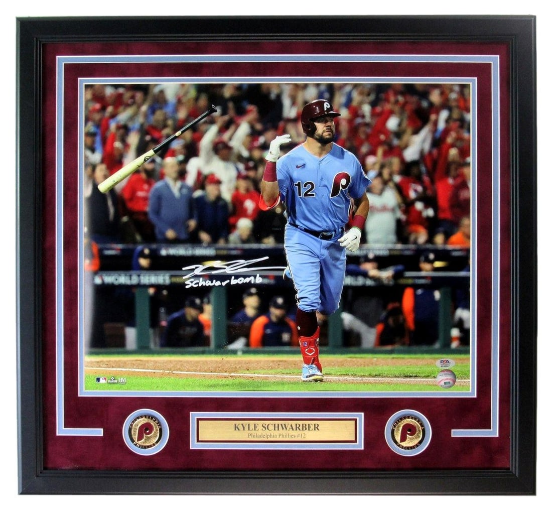 Framed 16x20 Kyle Schwarber Signed Schwarbomb Photo Phillies PSA DNA: Framed 16x20 Kyle Schwarber Signed Schwarbomb Photo Phillies PSA DNA Framed original 16x20 photo of Kyle Schwarber, autographed and inscribed "Schwarbomb." The piece features Philadelphia Phillies mem