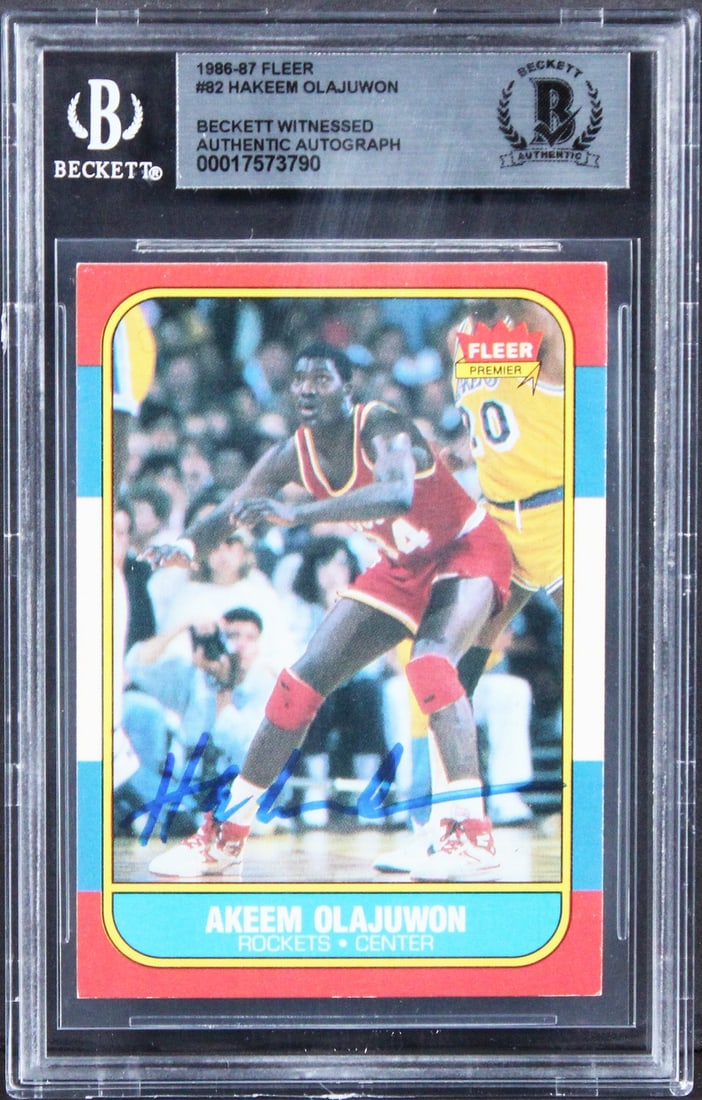 Hakeem Olajuwon Signed 1986 Fleer Rookie Card BAS Authenticated: Hakeem Olajuwon Signed 1986 Fleer Rookie Card BAS Authenticated This is an authentic signed 1986 Fleer #82 rookie card featuring Hakeem Olajuwon, the legendary player of the Houston Rockets. The card 