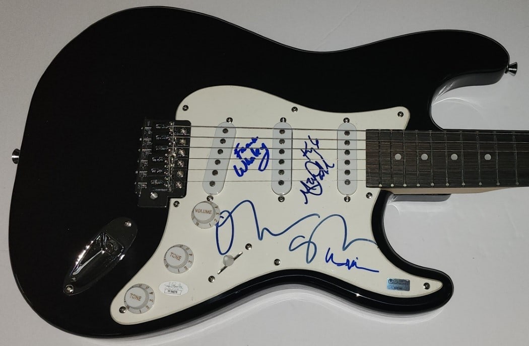 The Doors Movie Cast Autographed Guitar Val Kilmer Oliver Stone JSA: The Doors Movie Cast Autographed Guitar Val Kilmer Oliver Stone JSA This authentic autographed guitar features signatures from the cast of the iconic movie "The Doors," including Val Kilmer, Oliver St