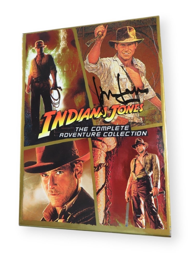 Harrison Ford Signed Indiana Jones DVD Cover JSA Authenticated: Harrison Ford Signed Indiana Jones DVD Cover JSA Authenticated This is an original DVD cover from the Indiana Jones collection, autographed by the iconic actor Harrison Ford. The signature has been au