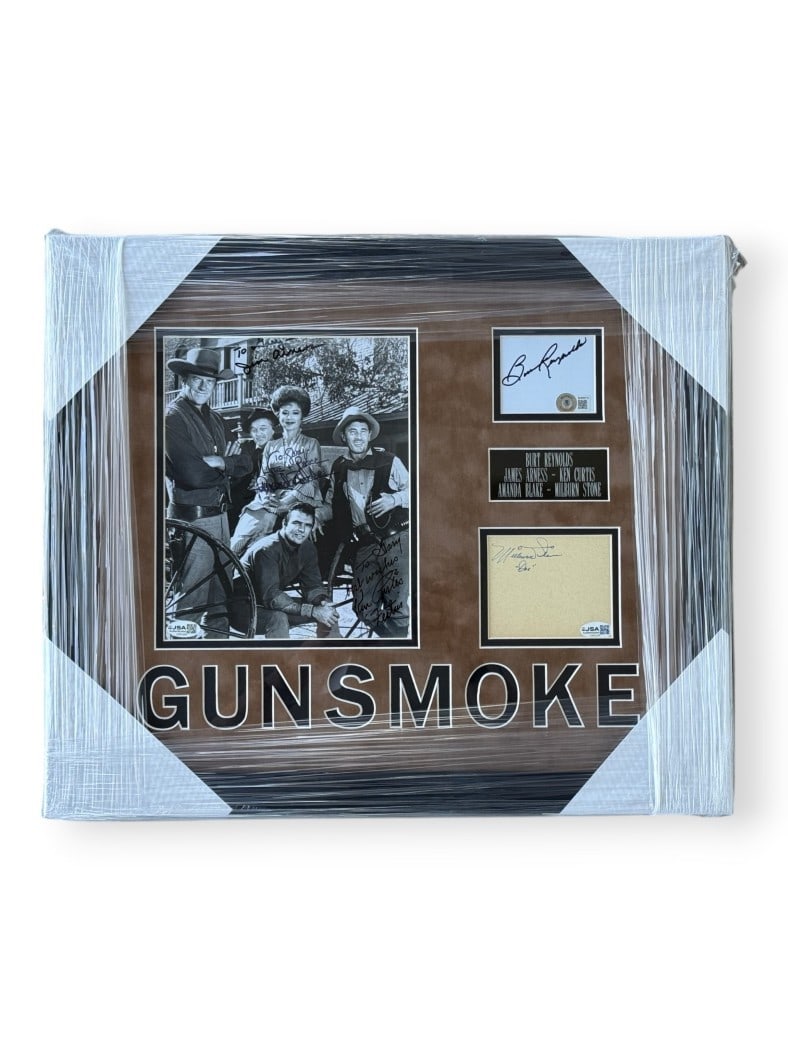 Framed Gunsmoke Photo with Cast Autographs JSA Authenticated: Framed Gunsmoke Photo with Cast Autographs JSA Authenticated This framed Gunsmoke display features authentic autographs from cast members Burt Reynolds, James Arness, Ken Curtis, Amanda Blake, and Mil