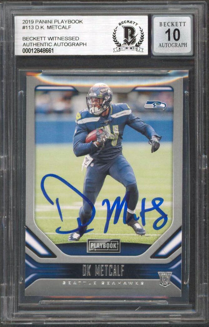 D.K. Metcalf Rookie Auto 2019 Playbook #113 Beckett Slabbed Gem Mint 10: D.K. Metcalf Rookie Auto 2019 Playbook #113 Beckett Slabbed Gem Mint 10 This 2019 Panini Playbook #113 rookie card features an authentic autograph from D.K. Metcalf of the Seattle Seahawks. The card i