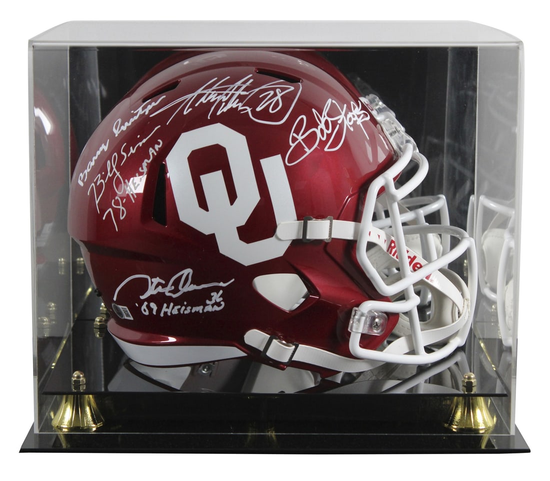 Oklahoma Sooners full size Speed replica helmet signed by 5 with Beckett case: Oklahoma Sooners full size Speed replica helmet signed by 5 with Beckett case Autographed full size Speed replica football helmet with UV mirrored back acrylic display case, personally signed by Adria