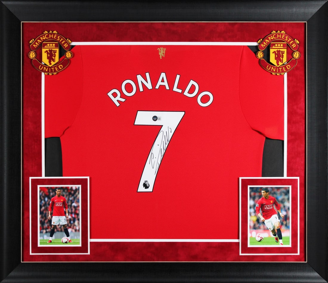 Framed Manchester United red Adidas jersey signed by Cristiano Ronaldo: Framed Manchester United red Adidas jersey signed by Cristiano Ronaldo This framed red Adidas jersey has been personally signed by Cristiano Ronaldo of Manchester United Football Club. The autograph i